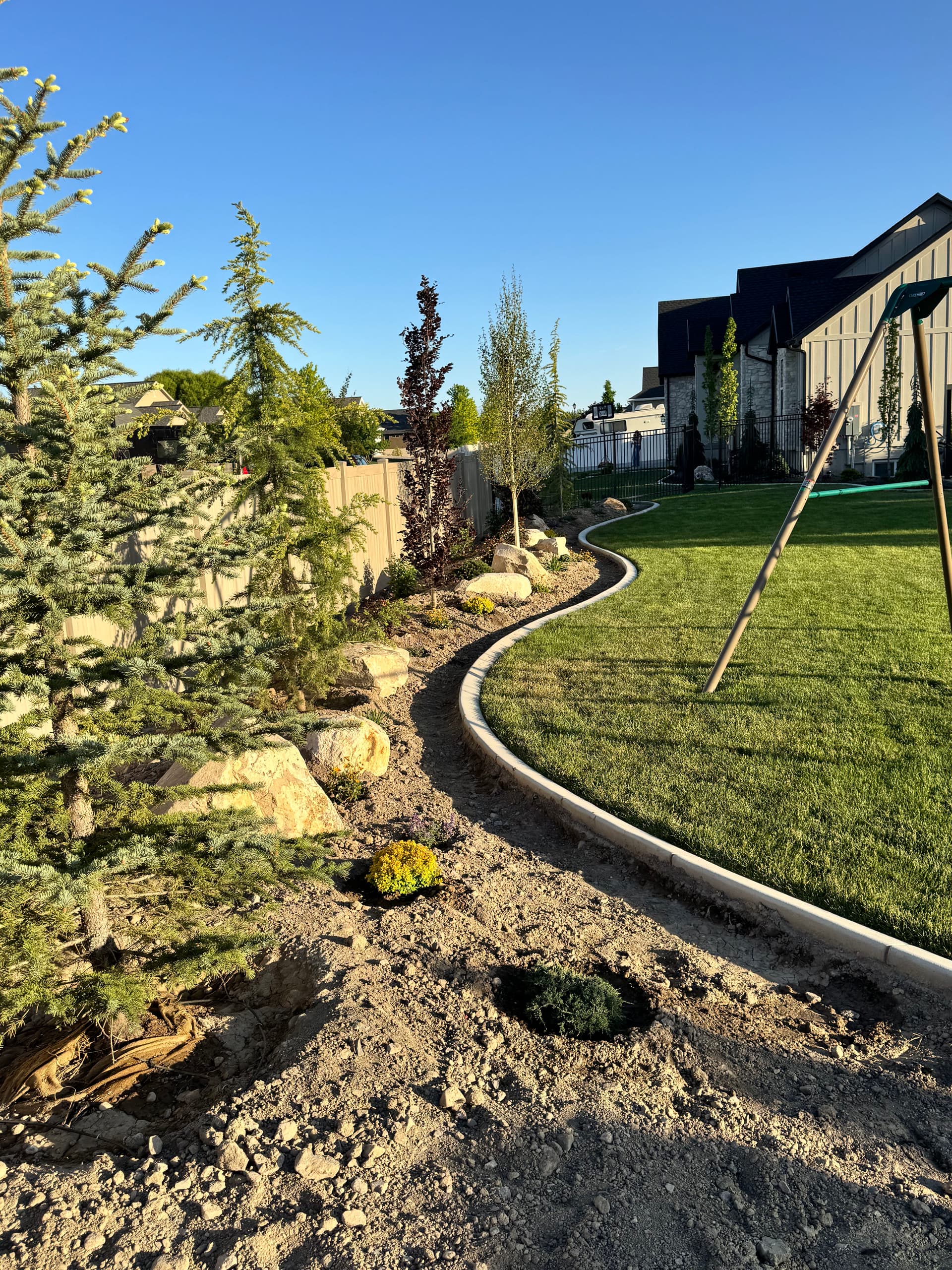 Gallery photos for Backyard Plant Installation with Trees, Boulders, and Black Mulch in Lehi: Image #4