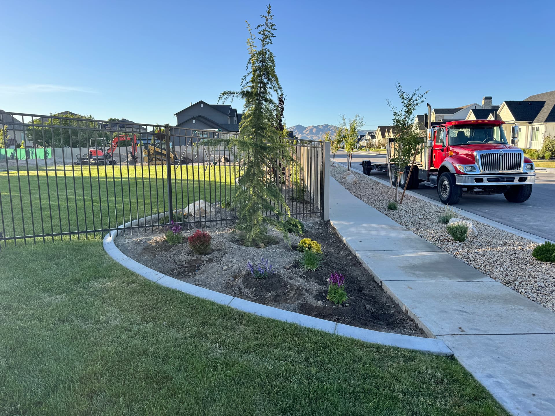 Gallery photos for Backyard Plant Installation with Trees, Boulders, and Black Mulch in Lehi: Image #2